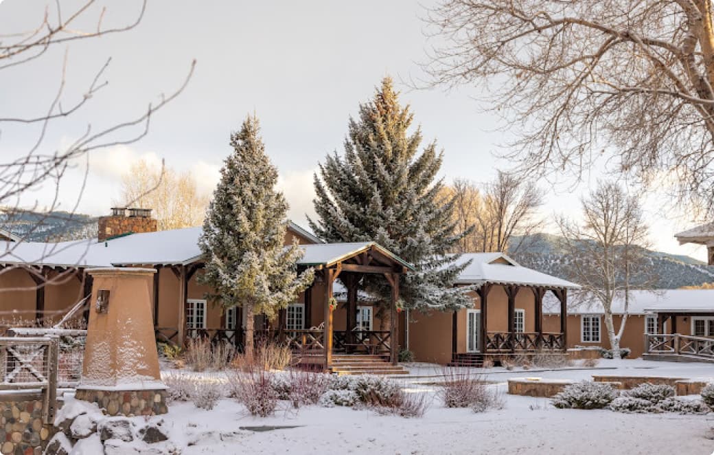 trinchera ranch guesthouses and grounds during a gentle winter's snow